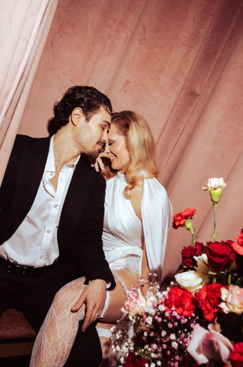 A couple sharing a quiet moment among flowers at Heartbreak Chapel