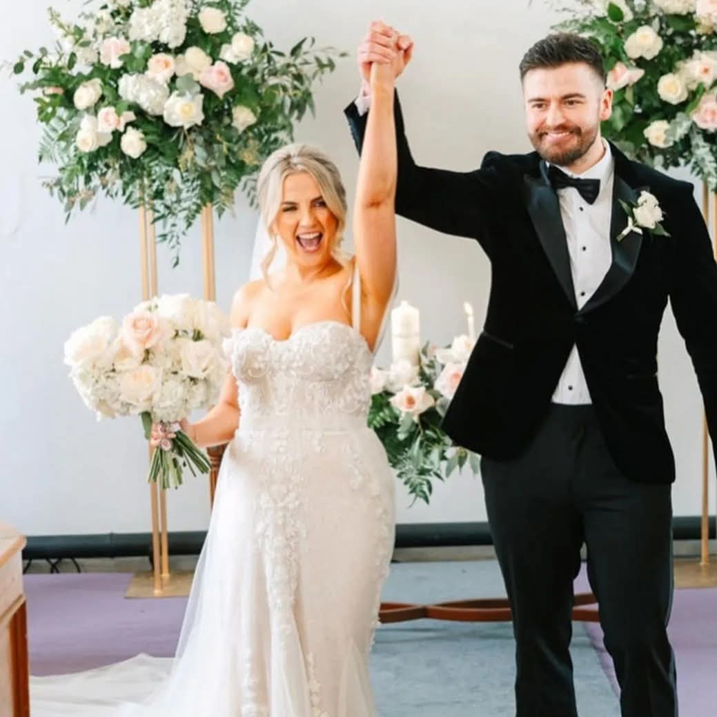 A couple celebrating after their ceremony inside Woodside Chapel