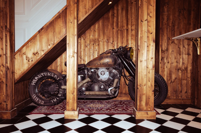 The Heartbreak Chapel motorcycle inside the wood panelled space